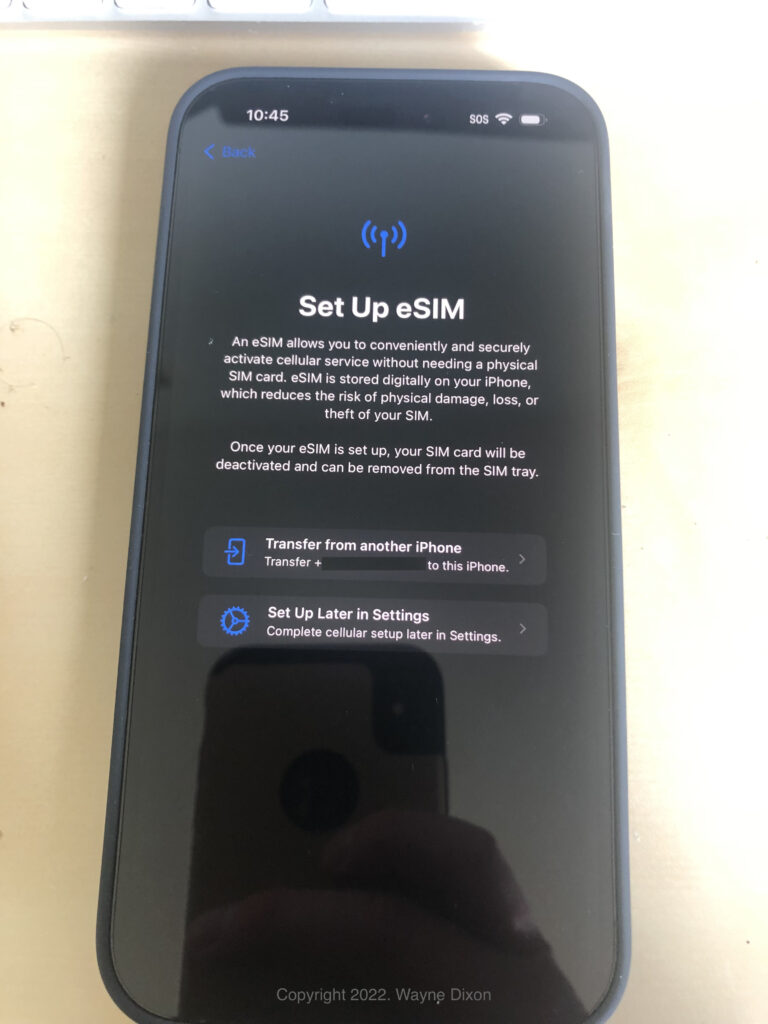 Photo of an iPhone 14 Pro Max on the "Set Up eSIM" screen.